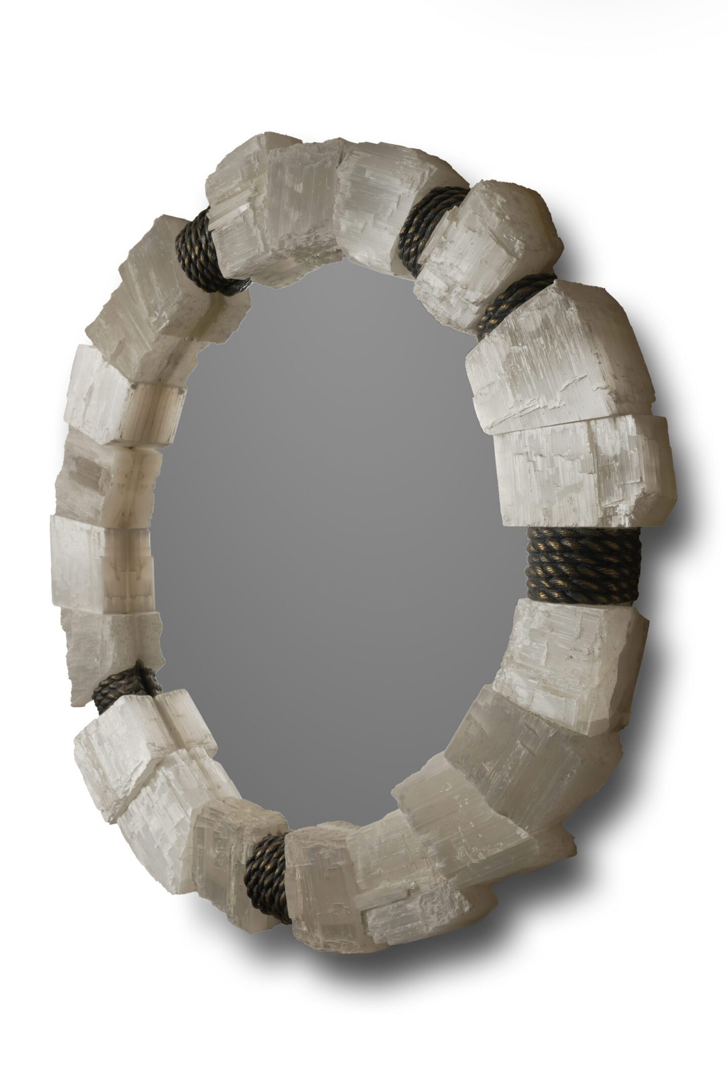 Oval mirror with selenite crystal frame