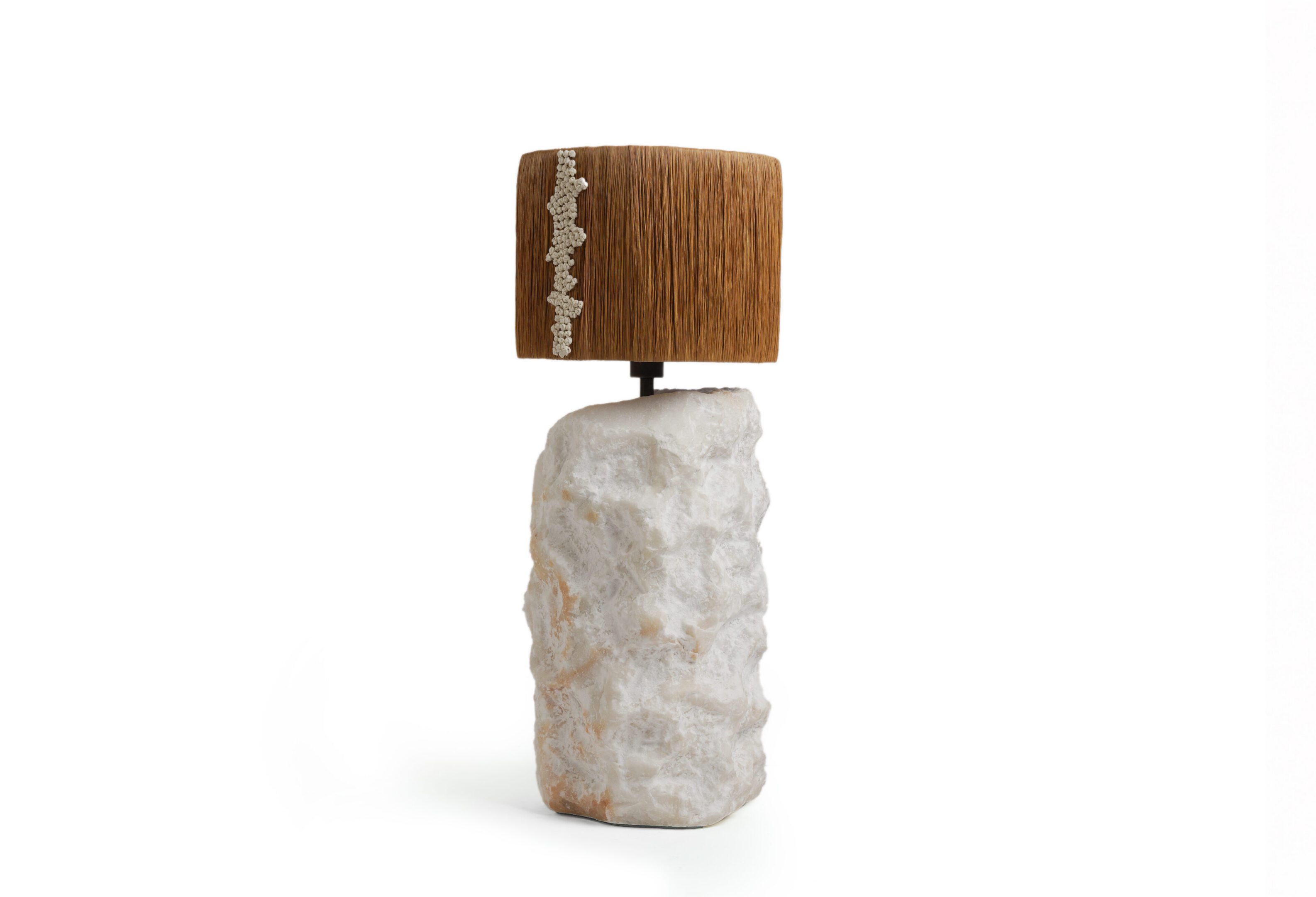 Table lamp with stone base and fringe shade