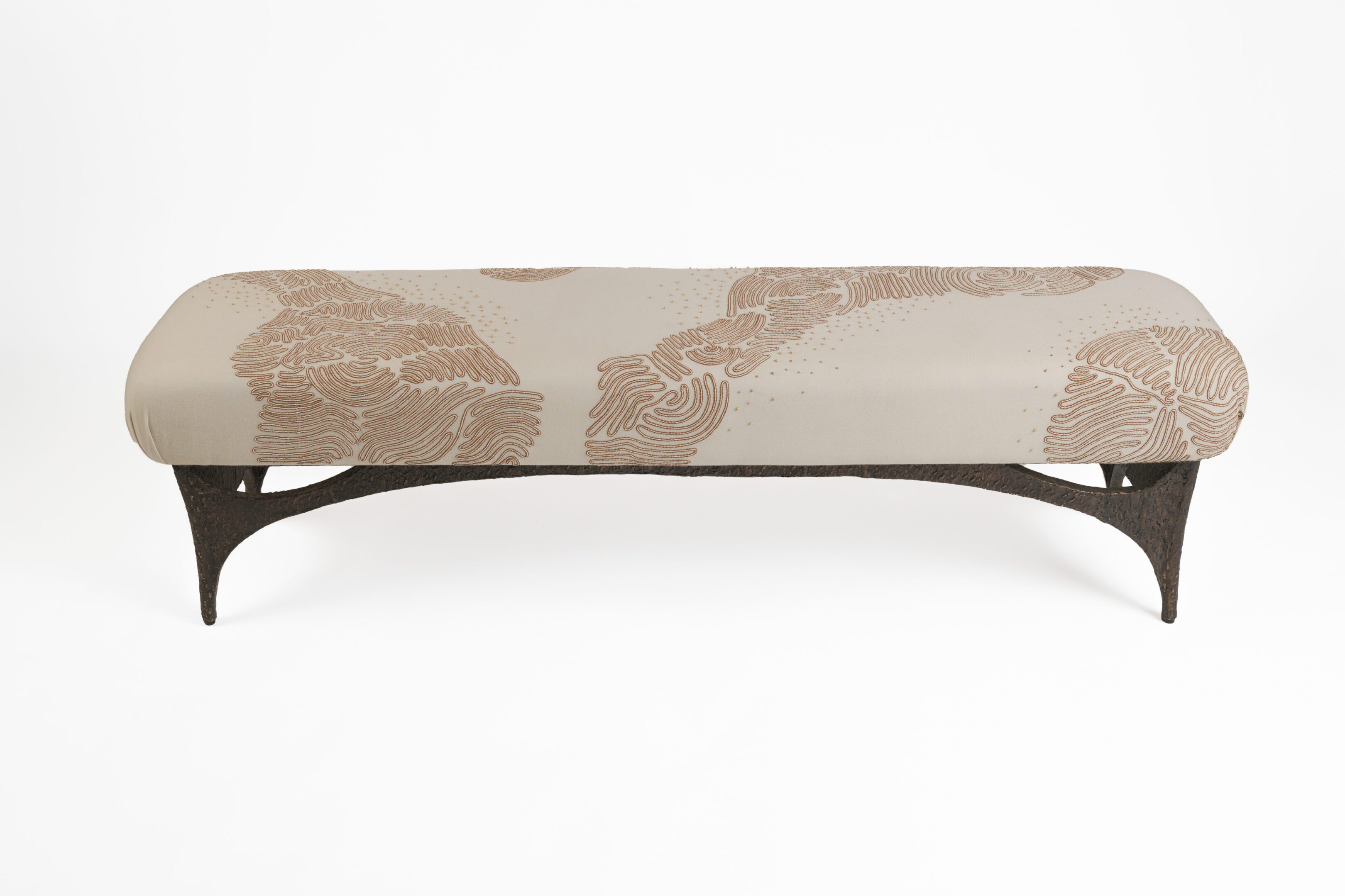 Beige patterned upholstered bench with dark legs