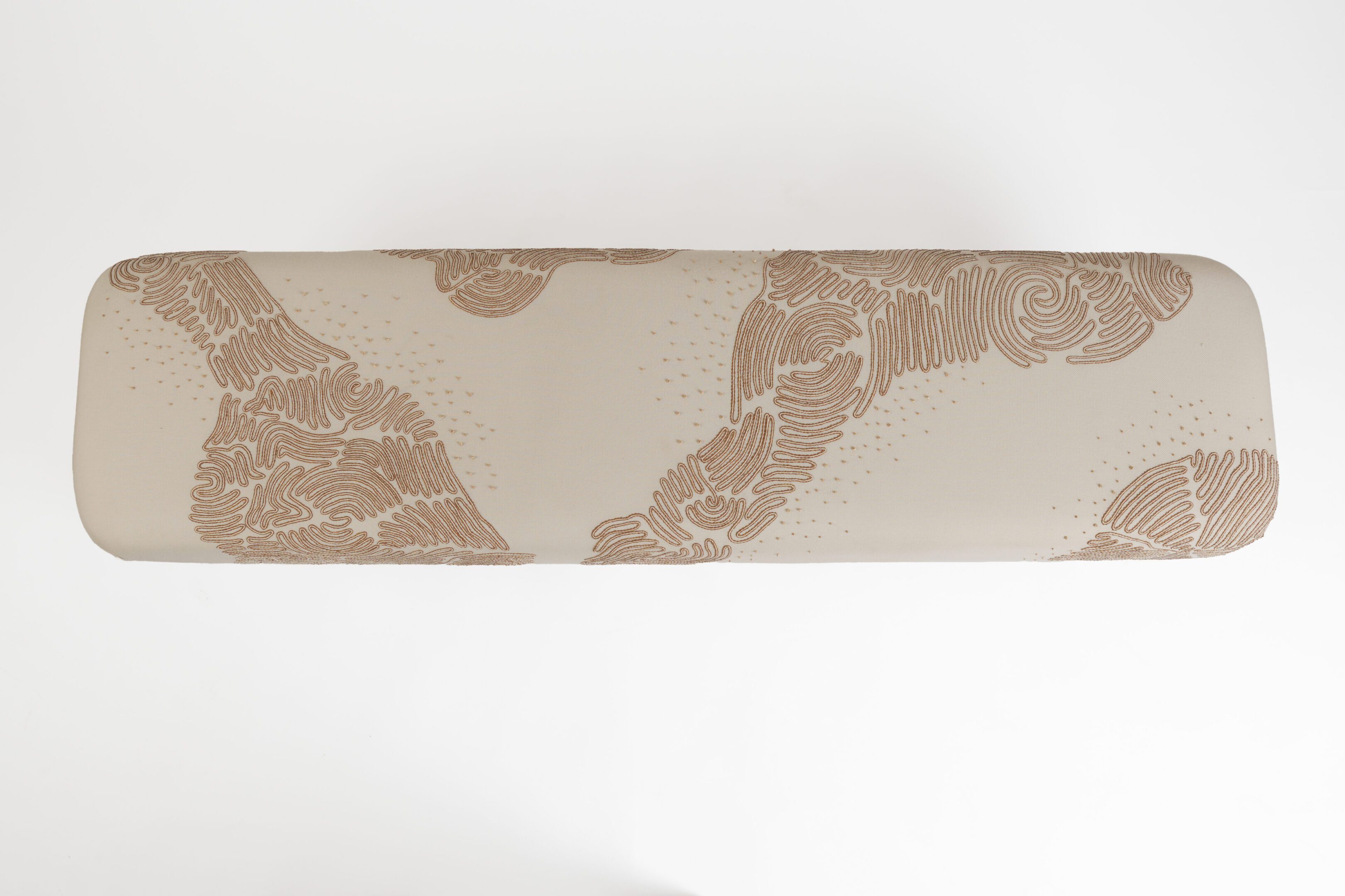 Beige bench cushion with brown abstract pattern